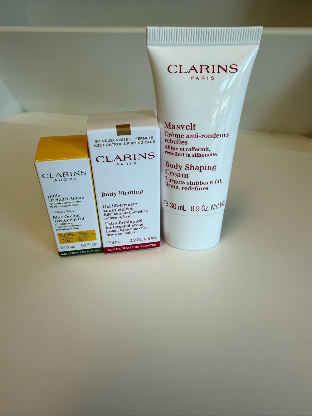 Clarins Travel Set: Body Shaping Cream, Body Firming Gel, & Face Treatment Oil